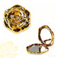 Elegante espejo de maquillaje plegable en oro rosa
